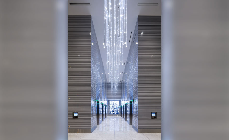 Using highend stone and installation, an office tower achieves a contemporary and