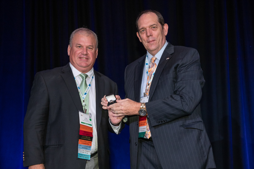 Nyle-Wadford-(l.)-receives-NTCA-Ring-of-Honor-from-James-Woelfel.jpg