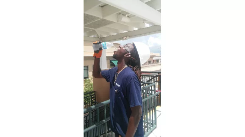 Western Worker Staying Hydrated in Heat .jpg