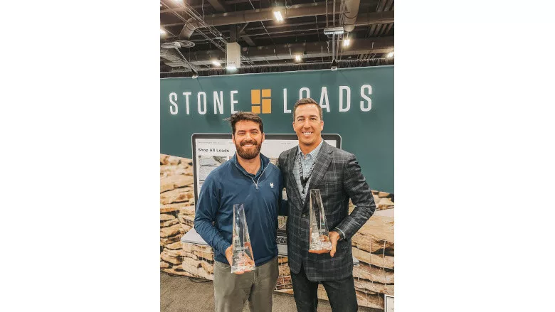 John Bryant (L) and Patrck Wells (R) hold TISE 2023 Awards.JPG