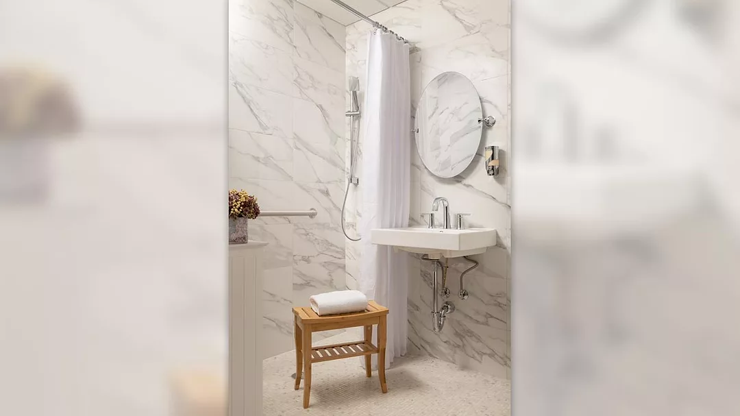 white marble-look tile bathroom