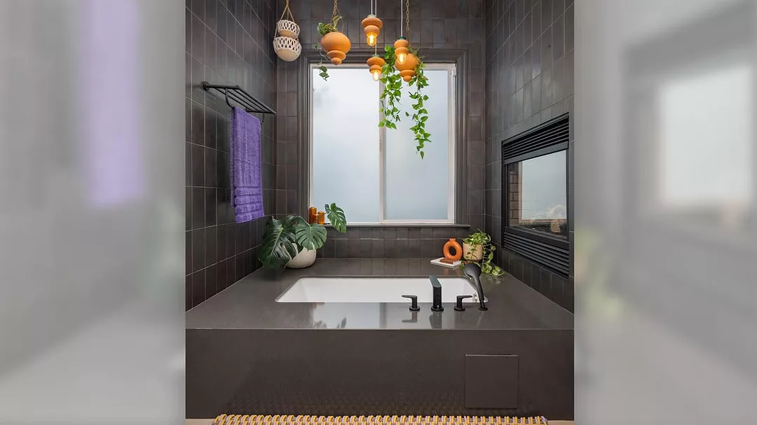 Black colored tile bathroom