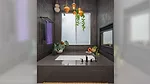 Black colored tile bathroom