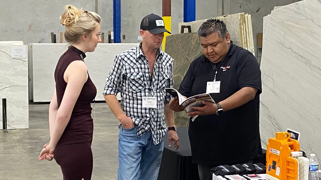 Attendees looking at products with sponsors at Austin Stone Industry Education event