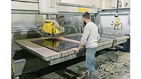 SW 1223 Fabrication shop SW 1223 Worker standing at a CNC machine in a fabrication shop