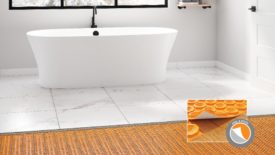 Schluter Peel-and-Stick uncoupling membrane on bathroom floor with a tub.
