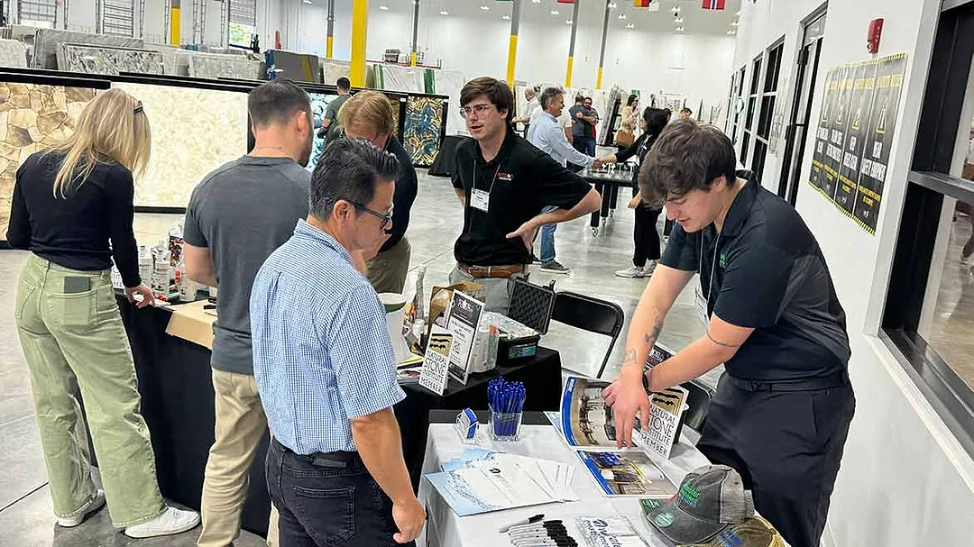 Attendees at Florida Stone Summit talking with sponsors