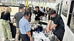 Attendees at Florida Stone Summit talking with sponsors