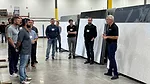 Participants of Stone Summit receiving a tour of slab facility at Marble of the World.