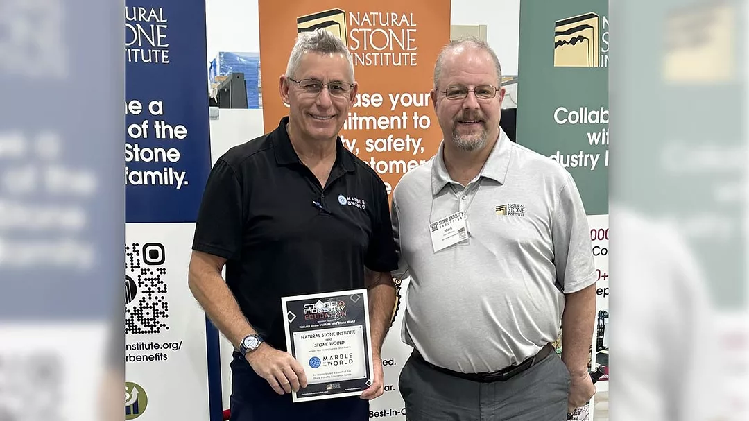 Mark Meriaux of the Natural Stone Institute (right) presents Frank Kraszewski of Marble of the World (left) with a certificate of appreciation.
