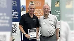 Mark Meriaux of the Natural Stone Institute (right) presents Frank Kraszewski of Marble of the World (left) with a certificate of appreciation.