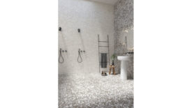 shower stall with pebble like tiles