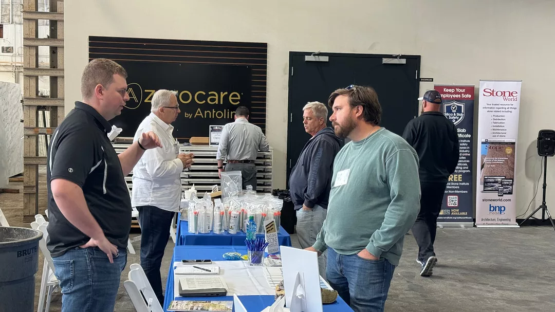 Attendees talking to sponsors at Alabama Stone Summit