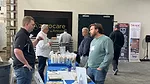 Attendees talking to sponsors at Alabama Stone Summit