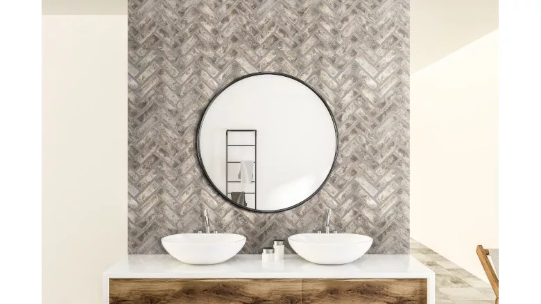 herringbone backsplash behind mirror