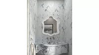 blue and white bathroom with sink and mirror