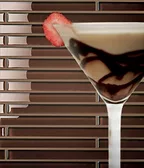 Nemo Tile + Stone Glass Box Collection (Cafe) with sundae against tiled backsplash