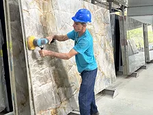 Worker at Slab in Brazilian Stone Production Facility