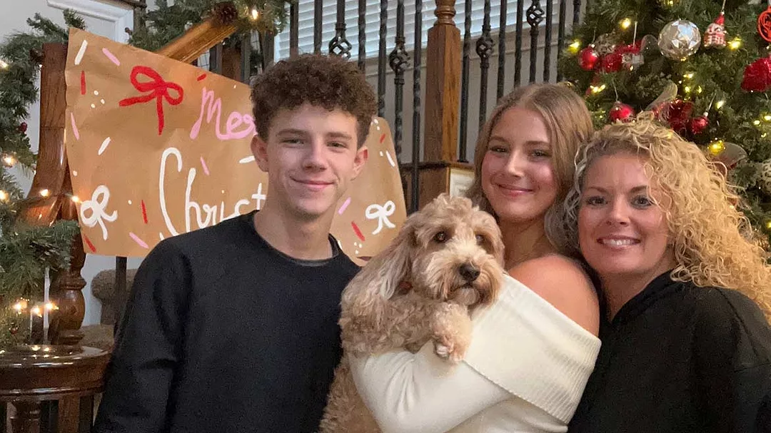Amie Gilmore with Family and Their Dog