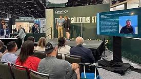Joey Ontra accepting 2025 Coverings Rock Star Award at the international stone and tile exhibition