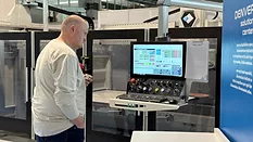 Fabricator looking at screen of CNC machine