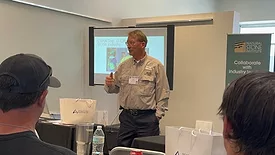 Jeff "Corky" Courtright of Planet Granite talking at the 2024 Denver Stone Summit