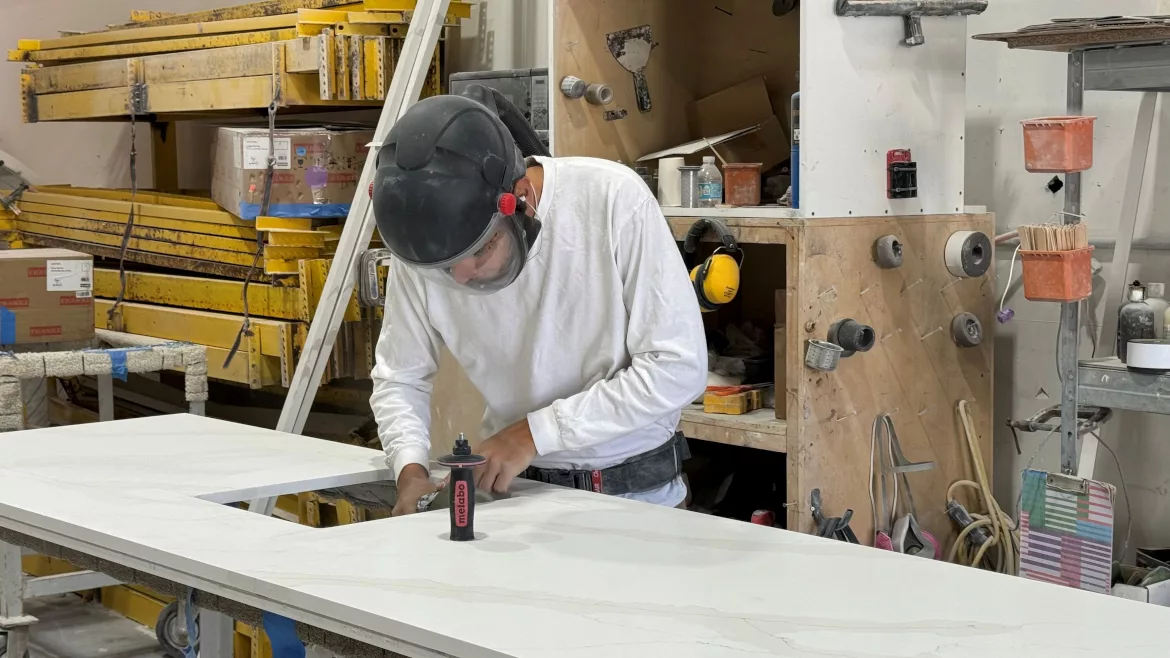 Shop Worker doing edge work with protective gear