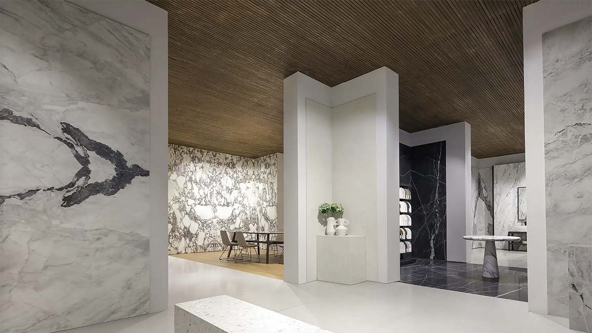 The image shows a booth for Anatolia Tile & Stone, a company that supplies ceramic and stone products.