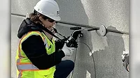 a professional conducting a structural inspection using a borescope or inspection camera