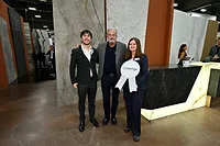 Antolini receiving best booth awards from Coverings management team