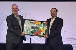Bart Bettiga and Luigi di Geso holding the president's award mosaic