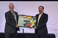 Bart Bettiga and Luigi di Geso holding the president's award mosaic