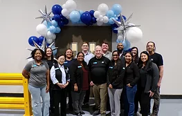 Laticrete Texas team with balloons celebrating reopening of expanded facility