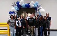 Laticrete Texas team with balloons celebrating reopening of expanded facility