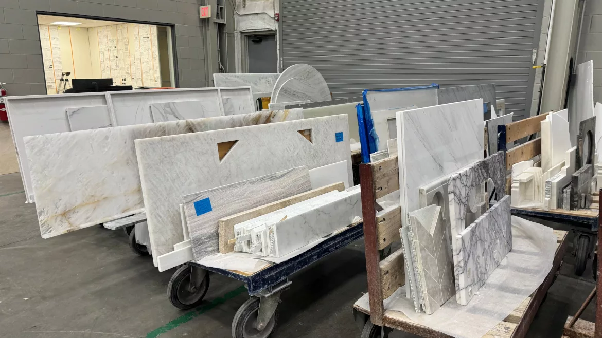 countertops on racks at a fabrication shop