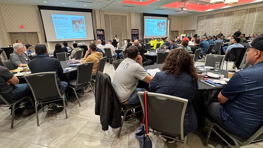 Molly Hauer, director of marketing at Park Industries, welcomes large group to FABX 2026