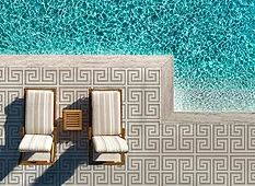 Artaic sintered glass tile in pewter collection used for pool patio flooring