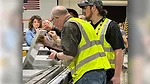 Fabricators looking at stone piece coming off of Comandulli edge polisher
