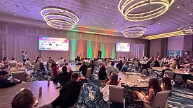 Audience in a ballroom during The Poseidon Experience