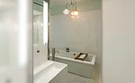 White Thassos marble on tub and shower walls