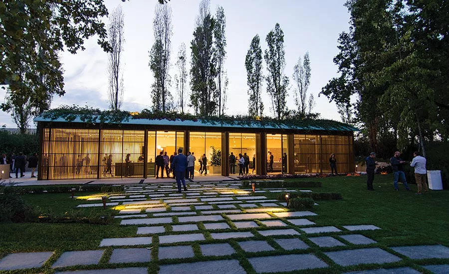 Inside the pavilion, a worktable and a wide range of samples