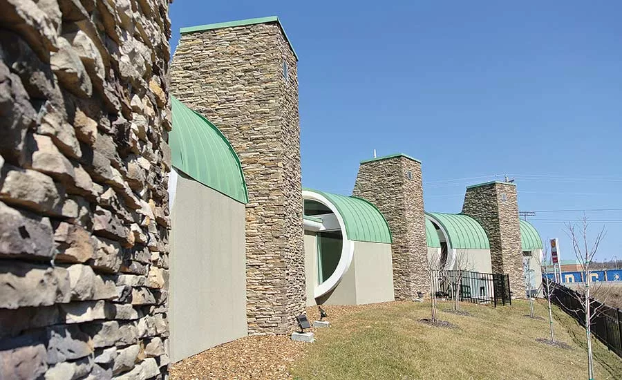 less use of stone for whole building facades
