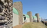 less use of stone for whole building facades