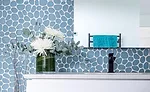 Pebble-like mosaic from Island Stone’s glass tile series, Spindrift