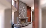 floor-to-ceiling stone fireplaces