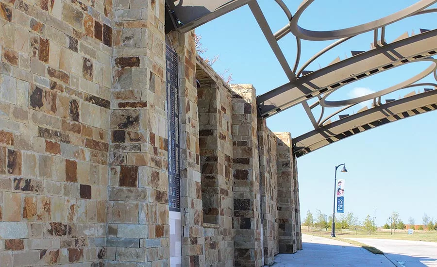 86-foot span of distinctive metal arches and stone pillars