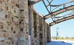 86-foot span of distinctive metal arches and stone pillars