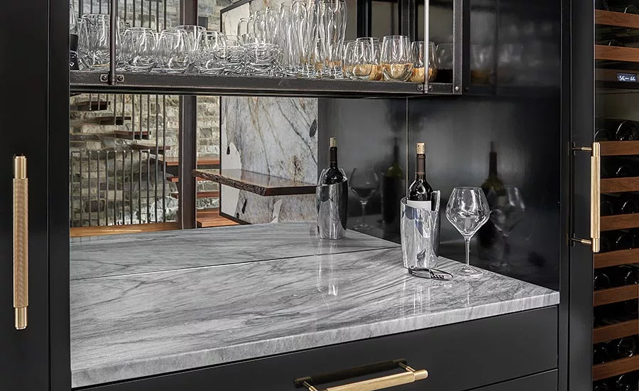 lighted bar in the dining area with White Shadow marble counter top