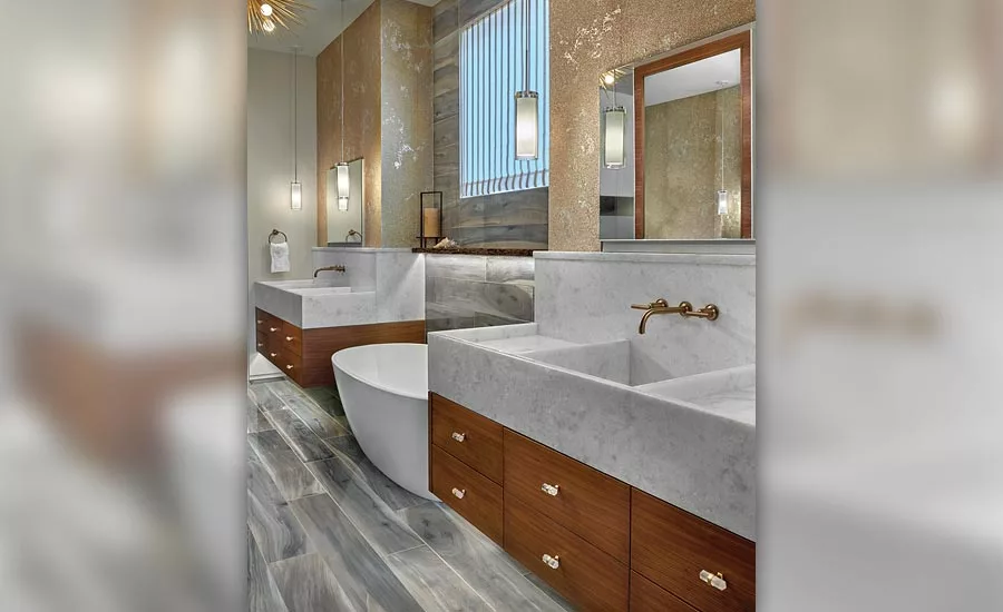 wooden cabinetry and Opal Calcite sinks in master bathroom