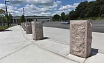16-inch x 4-foot bollards that were custom made by Granites of America